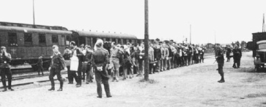 Prisoners lined up to transport to another prison camp